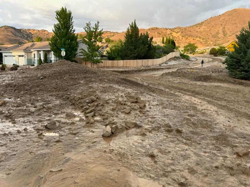 Photo of a home surrounded by a mud slide